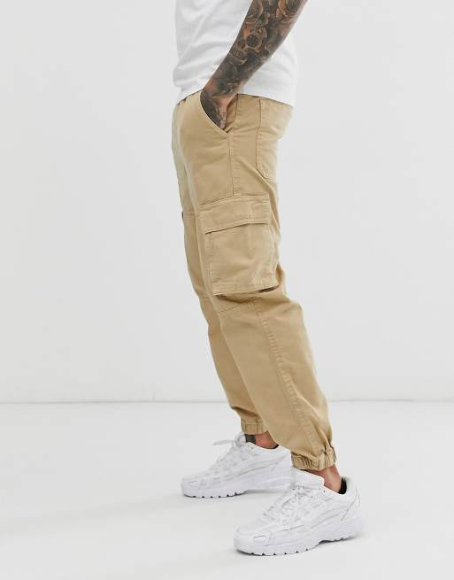 Bershka cargo trousers with pocket detail in beige ASOS