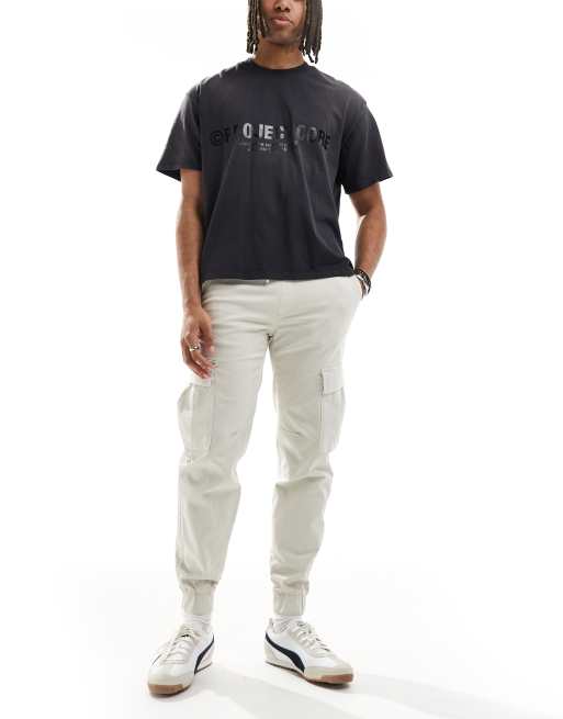 Bershka – Cargohose in Beige mit Bündchen