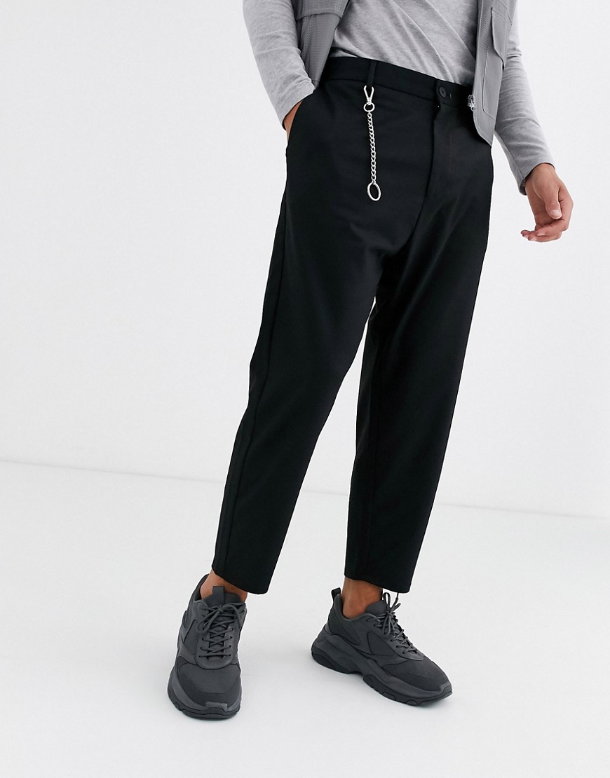 Bershka carrot fit pants with chain detail in black