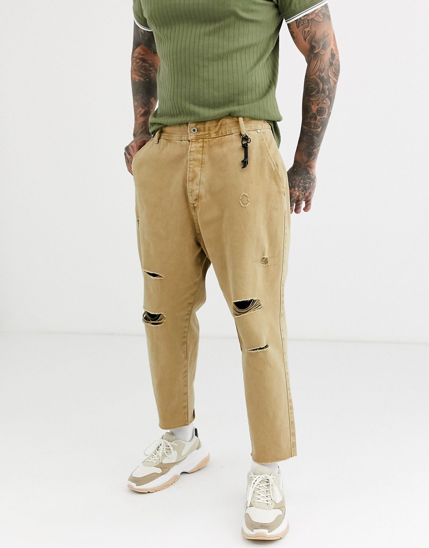 Bershka carrot loose fit jeans with rips in camel-Beige
