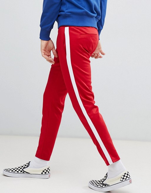 Bershka casual trousers in red with white side stripe | ASOS