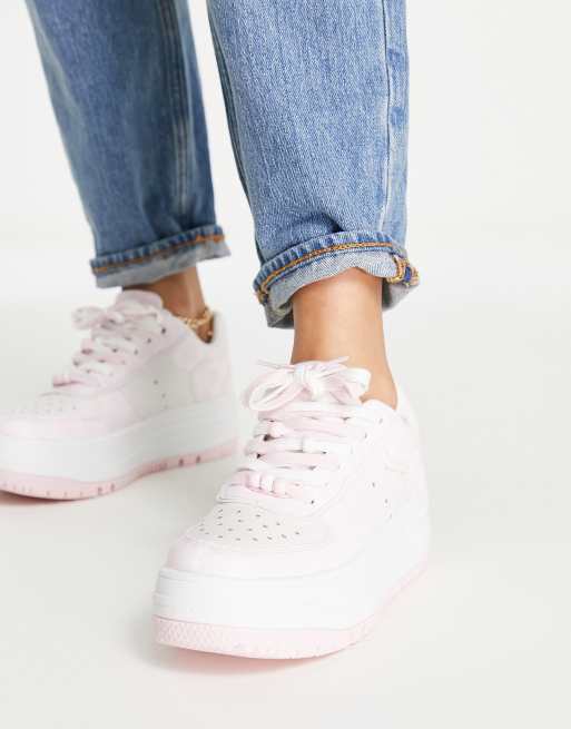 Pink and store white tennis shoes