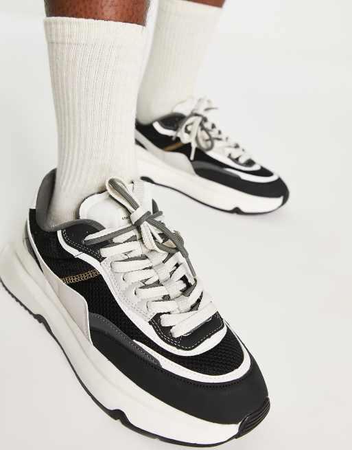 Bershka chunky runner sneakers in black white