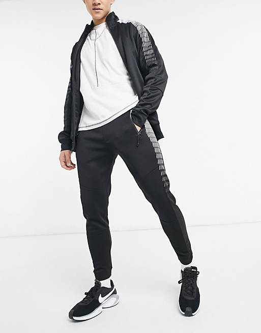 Tracksuits Bershka co-ord tracksuit joggers in black with side print 