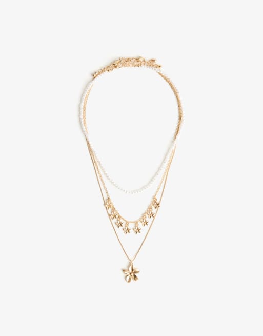 Bershka - Confezione da 3 collane color oro con ciondoli a fiore e in perle sintetiche