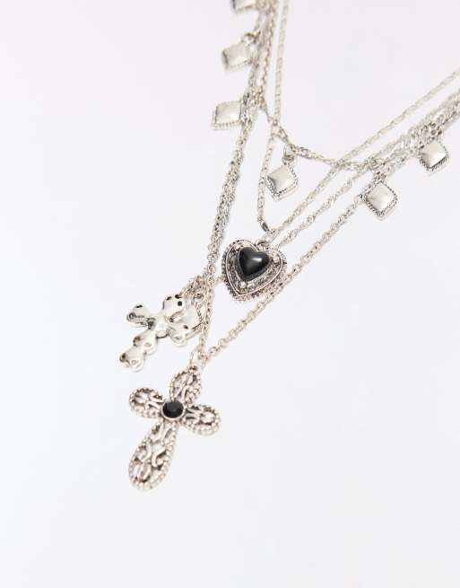 Bershka confezione da 4 collane con charm assortiti in argento, 2 di 4