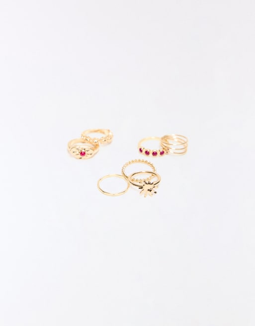 Bershka - Confezione da 7 anelli color oro con pietre