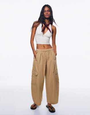 Bershka cotton barrel cargo trousers in beige - view 1