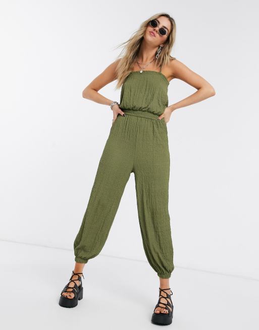 Bershka crinkle elasticated waist jumpsuit in khaki