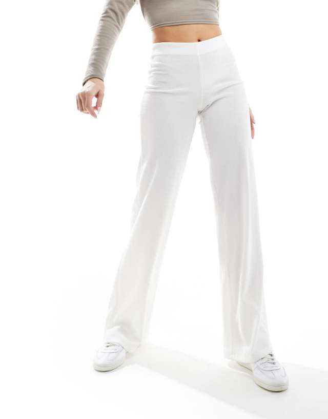 Bershka - crinkle flared beach trousers in white