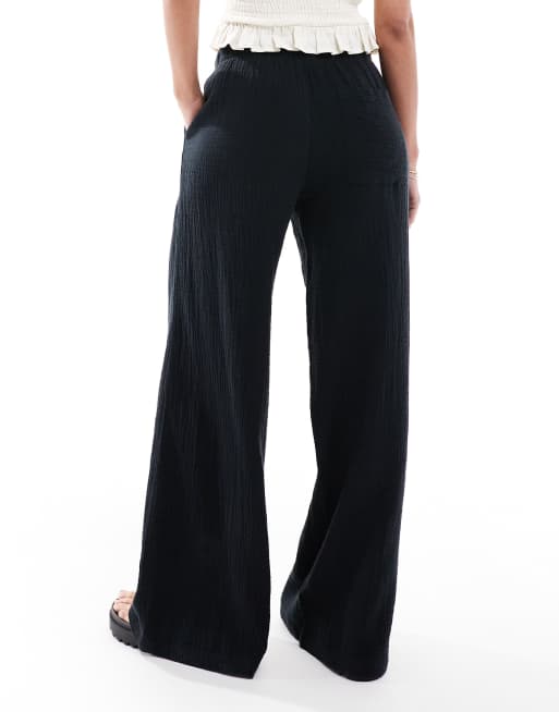 Bershka crinkle wide leg trousers in black