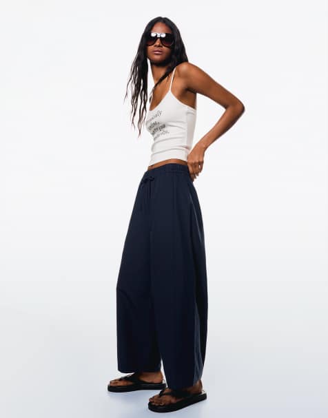 Bershka cropped barrel leg trousers in navy