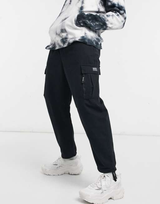 Bershka cuffed cargo pants in black ASOS