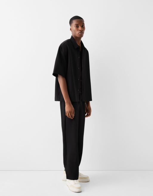 Bershka – Czarne dopasowane spodnie z szerokimi nogawkami