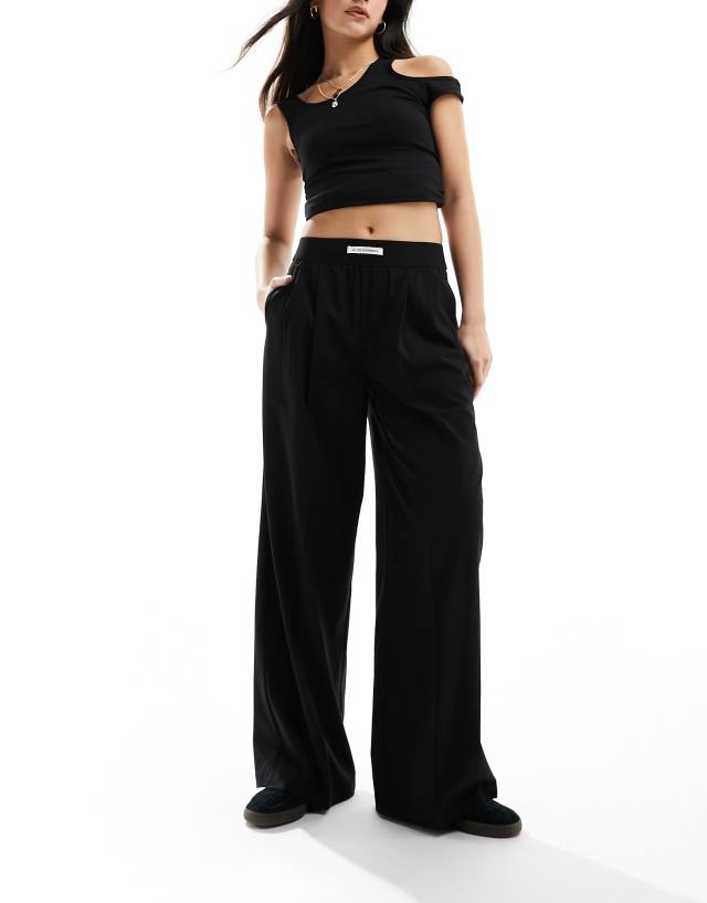 Bershka - deep waistband wide leg trousers in black