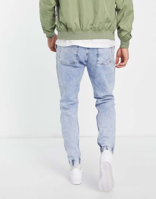 Bershka denim joggers with rips in blue