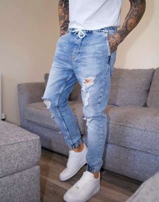 Bershka denim joggers with rips in light blue wash