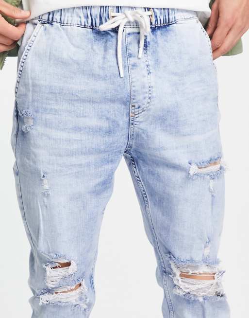 Bershka denim trackies with rips in blue ASOS