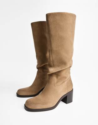  Distressed high-heel boots in sand