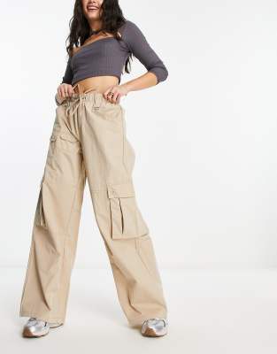 Bershka drawstring waist nylon wide leg cargo trousers in camel | ASOS