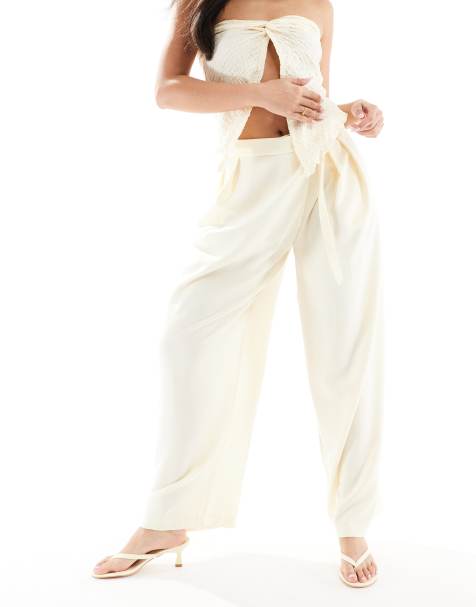 Bershka - Elegante broek met hoge gestrikte taille en wijde pijpen in lichtgeel - view 1