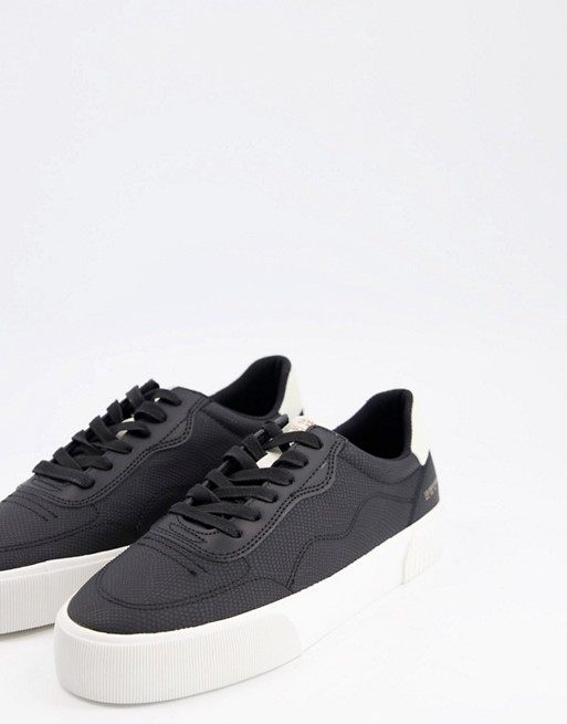 Bershka embossed trainers with contrast sole in black