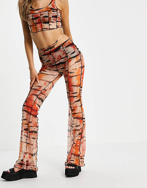 Bershka exposed seam patterened flare trouser with thong detail in orange