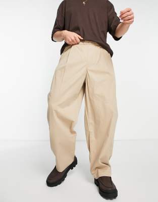 Bershka Bershka extra wide elasticated trousers in beige-Neutral