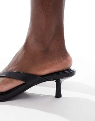 Bershka faux leather heeled flip flops in black | ASOS