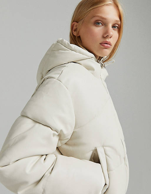 Coats & Jackets Bershka faux leather hooded puffer in cream 