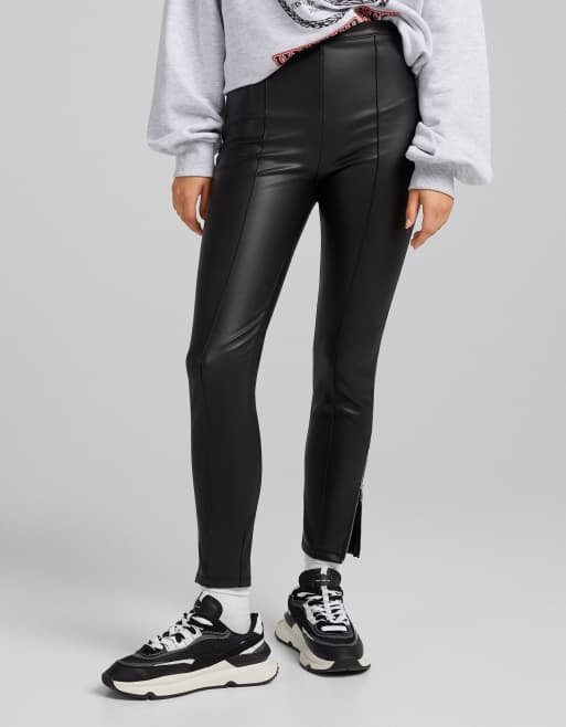 Bershka faux leather skinny pants with zip hem in black