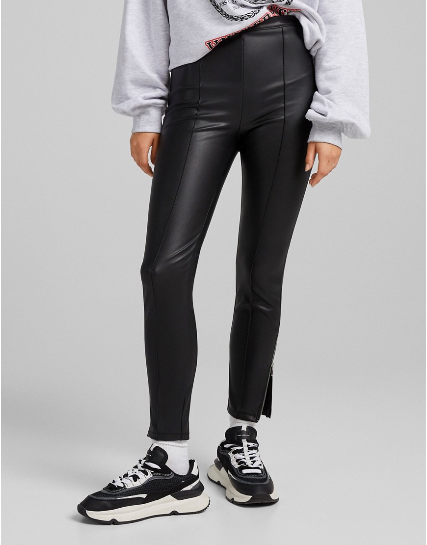 Bershka faux leather skinny trouser with zip hem in black