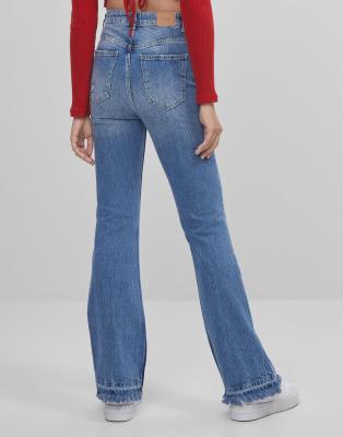 Bershka flare jean with rips in blue | ASOS