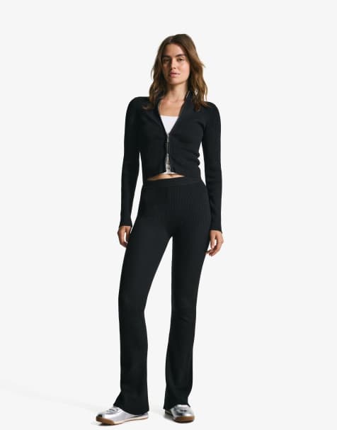 Bershka Flared trousers in black - view 1