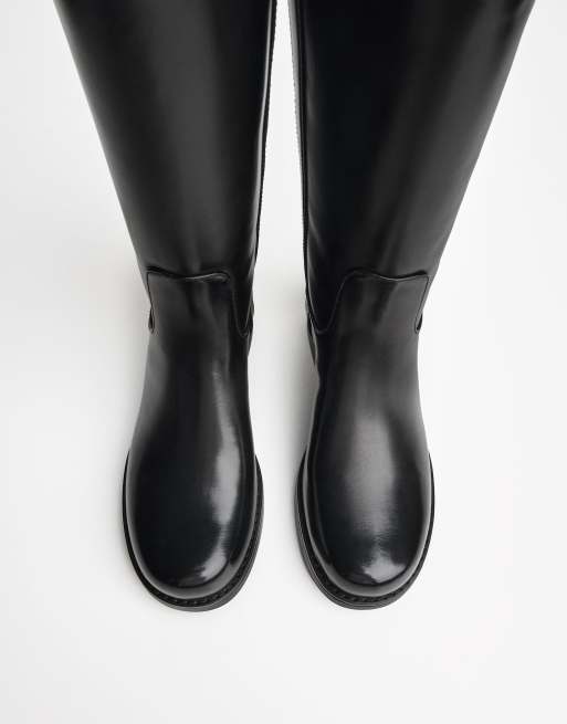 Bershka Flat knee-high boots in black