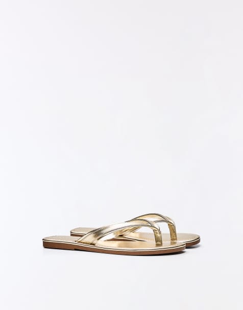 Bershka Flat thong sandals in gold - view 1