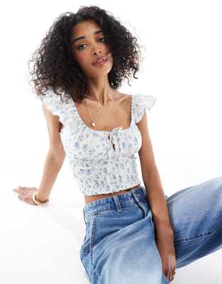 Bershka - Gesmoktes Milchmädchen-Oberteil in Ecru mit Blumenmuster in Blau