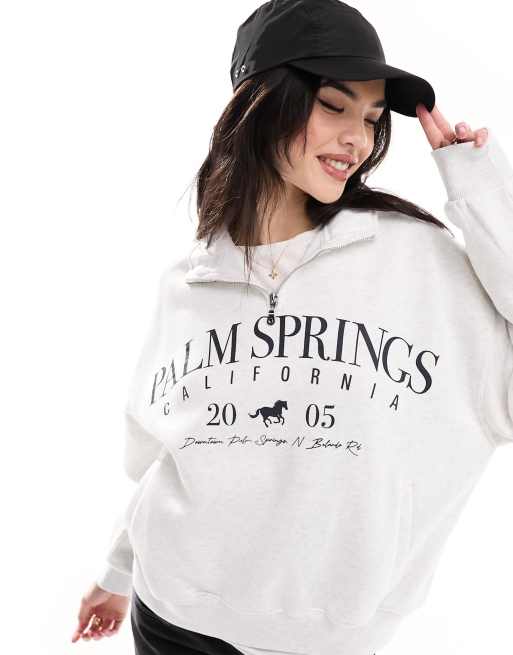 Bershka – Grå sweatshirt med kort dragkedja vid halsen och Palm Springs-tryck