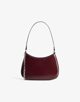 Bershka - Halbmondförmige Minitasche in Burgunderrot