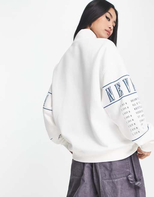 Bershka half zip Idaho apres ski sweatshirt in white | ASOS