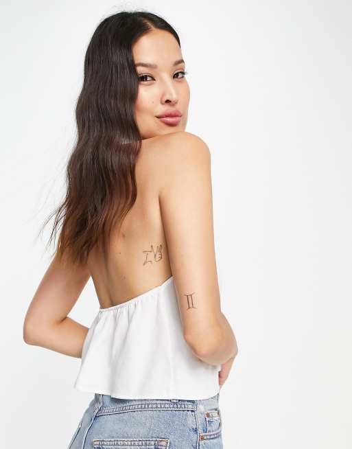 Bershka halterneck knot detail crop top in white, 2 of 4
