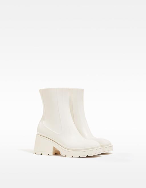 Bershka heeled ankle welly boots with square toe in ecru ASOS