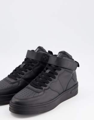 black trainers with velcro straps