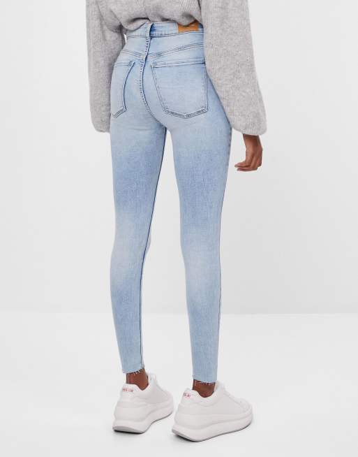 Bershka high rise skinny jeans in bleach blue ASOS