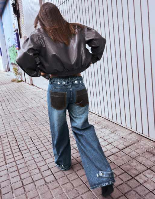 Bershka High-waist barrel jeans with leather effect pocket in mid blue ...