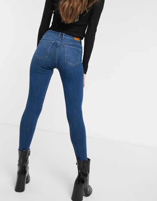 Bershka high waist skinny jean in dark blue with knee rip ASOS