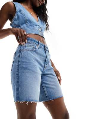 Bershka High Waisted Raw Hem Longline Denim Shorts In Mid Blue