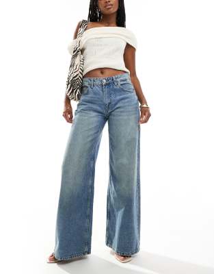 Bershka Bershka high waisted wide leg jeans in dirty mid blue wash