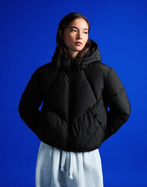 Bershka Hooded puffer jacket in black - view 1