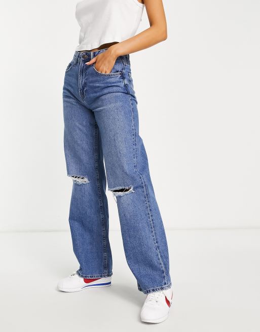 Bershka - Jaren 90 jeans met wijde pijpen en scheuren in middenblauw